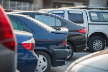 Obraz na płótnie Canvas cars in a row on a parking lot
