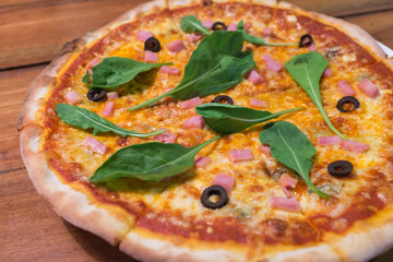 traditional wood burn Italian pizza with bacon and spinach topping