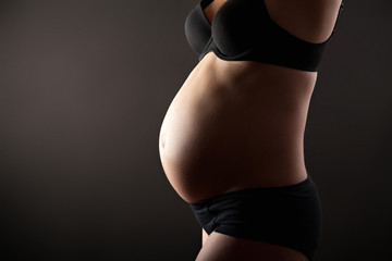 Fototapeta premium Belly of pregnant woman