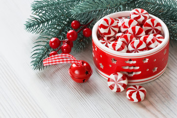 Peppermint Christmas candy / Peppermint sweet candy and Christmas decoration jingle bell and pine branch