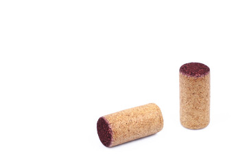Two used wooden wine corks isolated on white