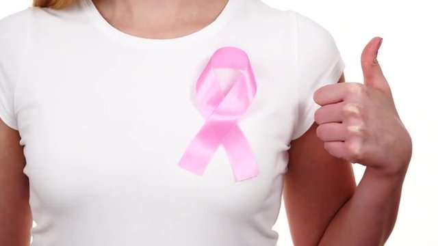 Woman wih pink cancer ribbon on chest 4K