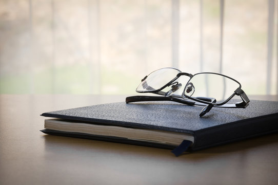 Glasses on a book