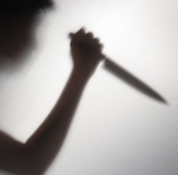 Silhouette Of Someone Holding Knife,blur Image