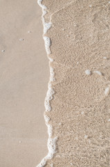 Clear water surf in the sand