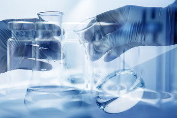 scientist hand with laboratory background