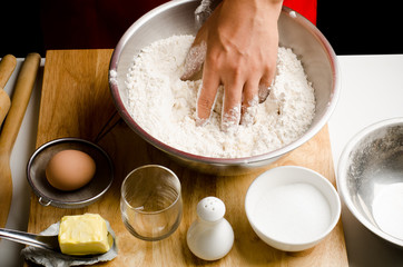 Preparation bread cooking,mixing the flour and yeast in the bowl