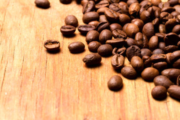 Coffee beans on wood background