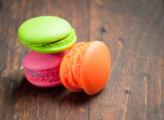 French colorful mini macarons on wood table