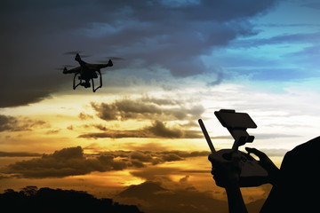 Male pilot controlling drone © Leo Lintang