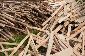 Pile of old and dirty lumber in construction site