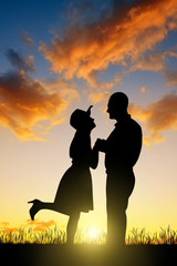 Silhouette of couple in love at sunset