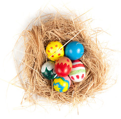 Fototapeta na wymiar Easter eggs and hay on wooden background,morning light