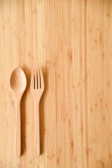 Wooden spoon and fork on table