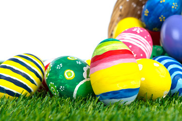 Fototapeta na wymiar Easter Eggs on Fresh Green Grass over white background