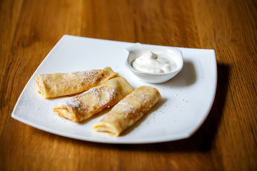 crepes stuffing plate background wooden table