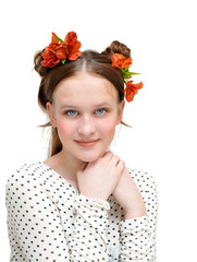 Young girl in white blous and beautiful flowers in her hair.