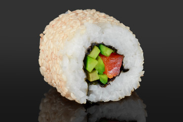 Sushi rolls with avocado, salmon and sesame seeds. © vitals