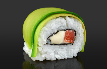 Sushi rolls with avocado, salmon and philadelphia cheese.
