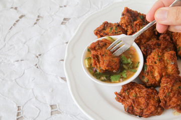 Eating Thai fish cakes, selective focus,