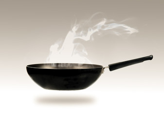 frying pan and smokw in kitchen,vintage color toned image