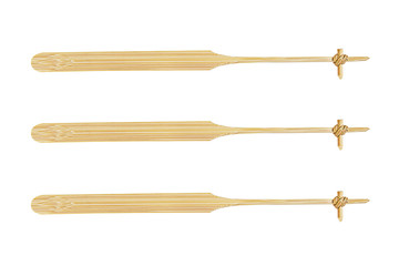 Three bamboo stirrers isolated on white background