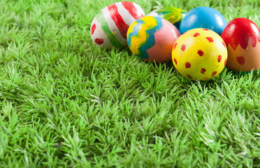 Fototapeta premium Easter eggs on green grass