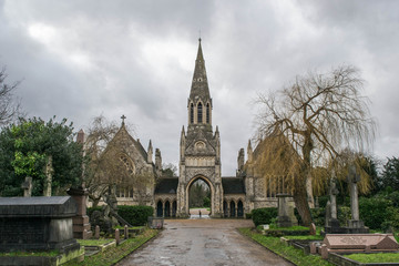 Fototapeta na wymiar Church In Cemetery On Overcast Day London