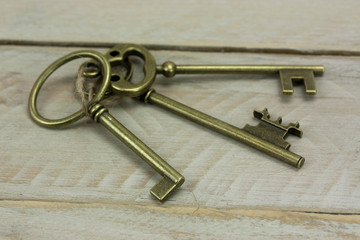 Old keys on a rustic background
