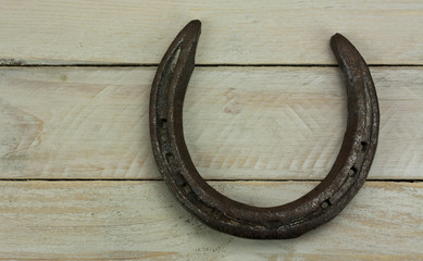 Horseshoe on a wooden background