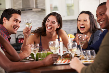 Group Of Friends Enjoying Dinner Party At Home