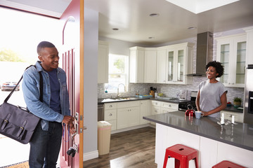Woman Greeting Man Returning Home From Work