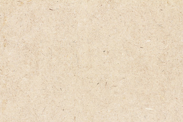 Pressed beige chipboard texture. Wooden background.