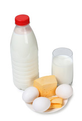 Cheese with milk in glass on white background