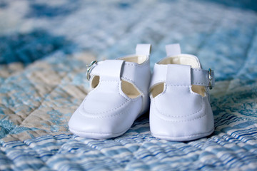 Closeup of white baby shoes