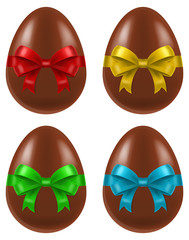 Set of four chocolate Easter eggs with colored ribbons.