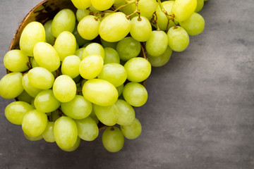 Grape cluster on the grey background.