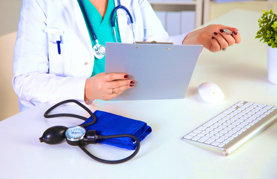 Portrait of happy medical doctor woman in office