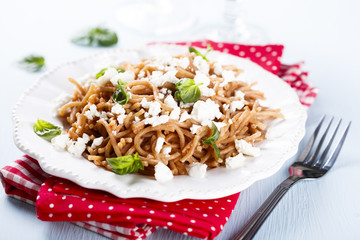 Spelt pasta with tomato sauce and feta cheese