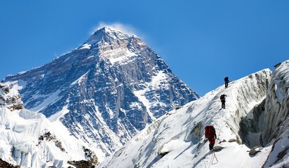 view of Everest from Gokyo valley with group of climbers