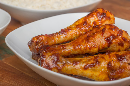 Marinated indonesian chicken drumsticks with rice