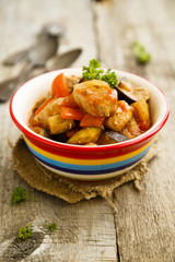 Pork stew with pepper, eggplant and tomatoes