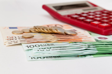 Euro money and the calculator.