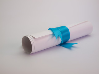 Diploma tied with a blue ribbon ,Put on a white background. (vintage)