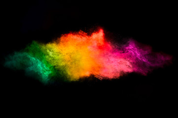 Color Explosion. Dust Particle Isolated on Black Background