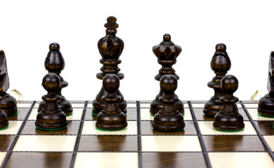 Chess battle on wood board on white background