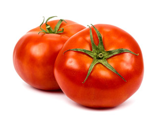 Two tomatoes isolated on a white background.