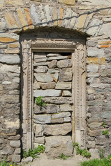 old stone wall and door