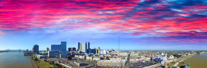 Sunset sky over New Orleans. Aerial view of city and river