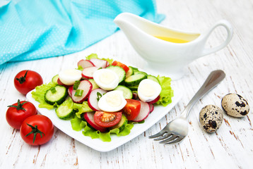Spring salad with eggs, cucumbers and radish